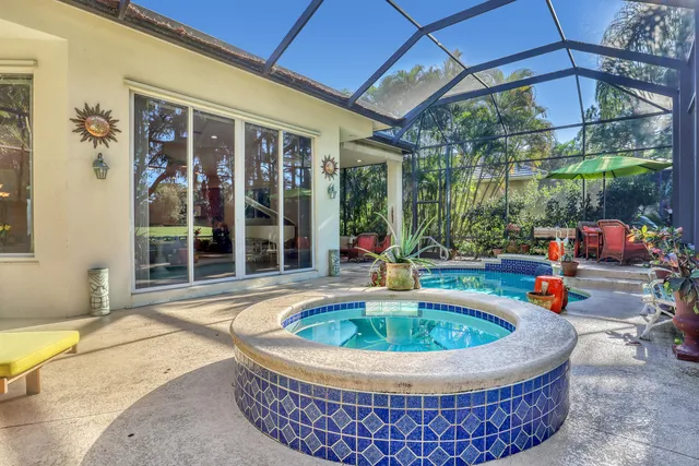 an aerial view of residential houses with outdoor space and seating area