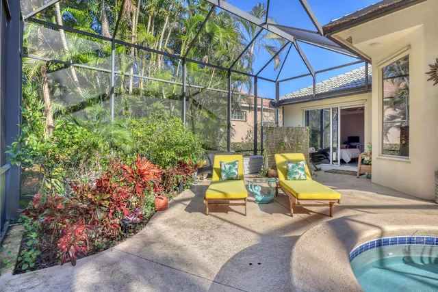 a view of a swimming pool and a yard