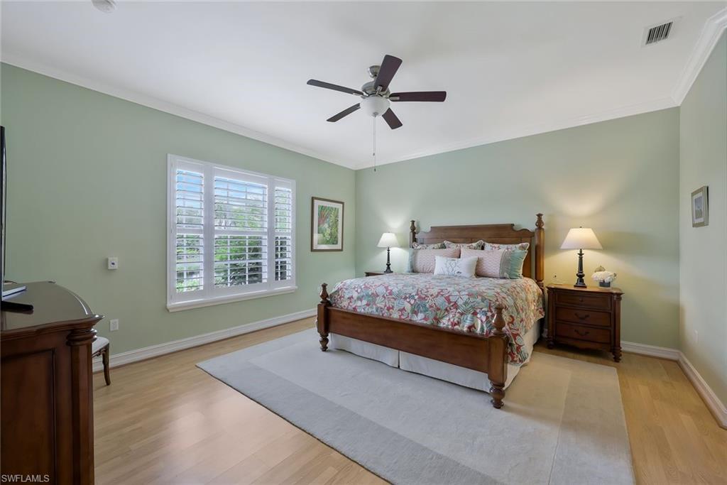 5012 Maxwell Circle, Unit 101 Naples, FL 34105 - Photo 12 of 23 a bedroom with a bed and window