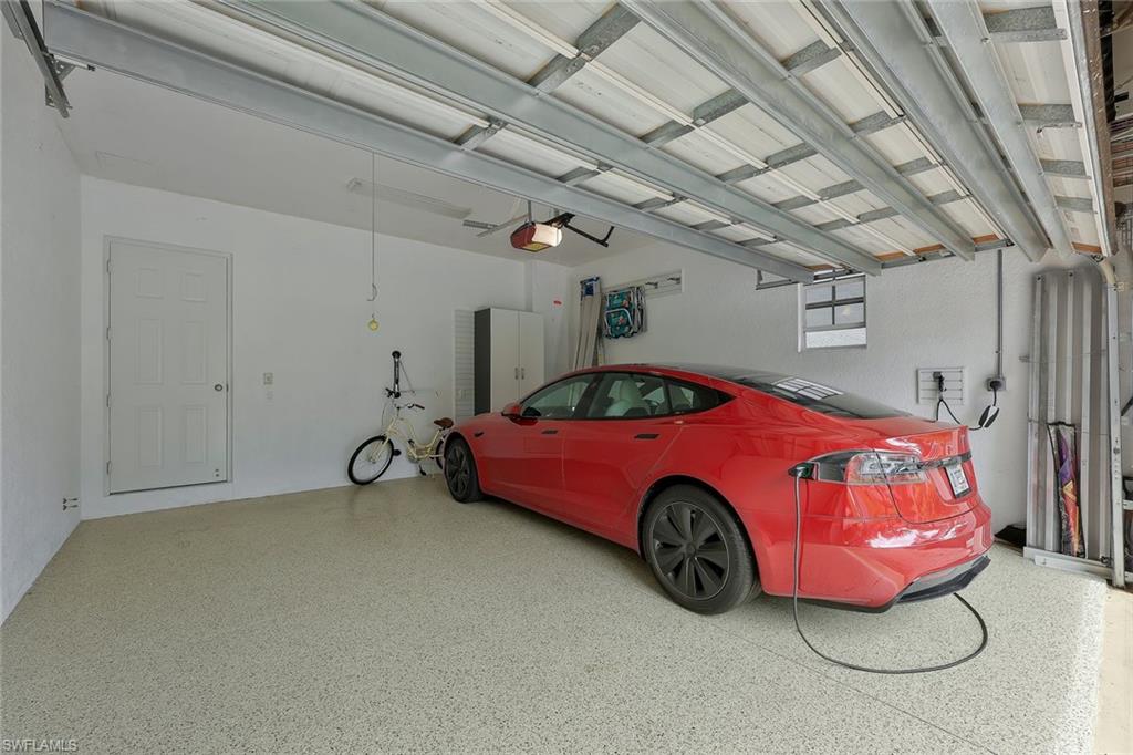 5012 Maxwell Circle, Unit 101 Naples, FL 34105 - Photo 19 of 23 a car parked in a garage