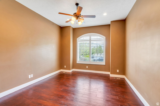 1355 West 1000 South Mapleton, UT 84664 - Photo 16 of 74 Spare room featuring dark wood-style floors, ceiling fan, and a textured ceiling