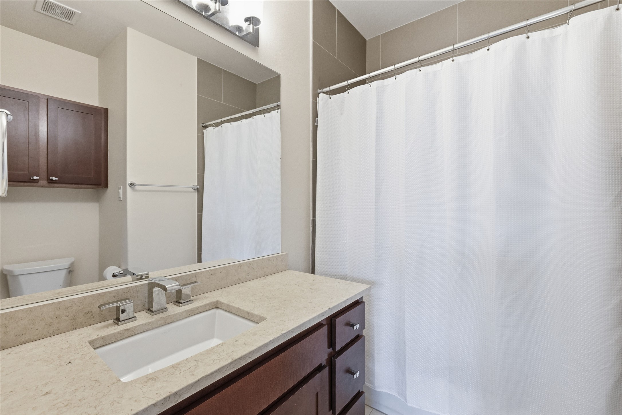 4124 Valley View Road, Unit 4A & 4B Austin, TX 78704 - Photo 16 of 40 Functional full bathroom with modern vanity, mirror, and tiled shower.