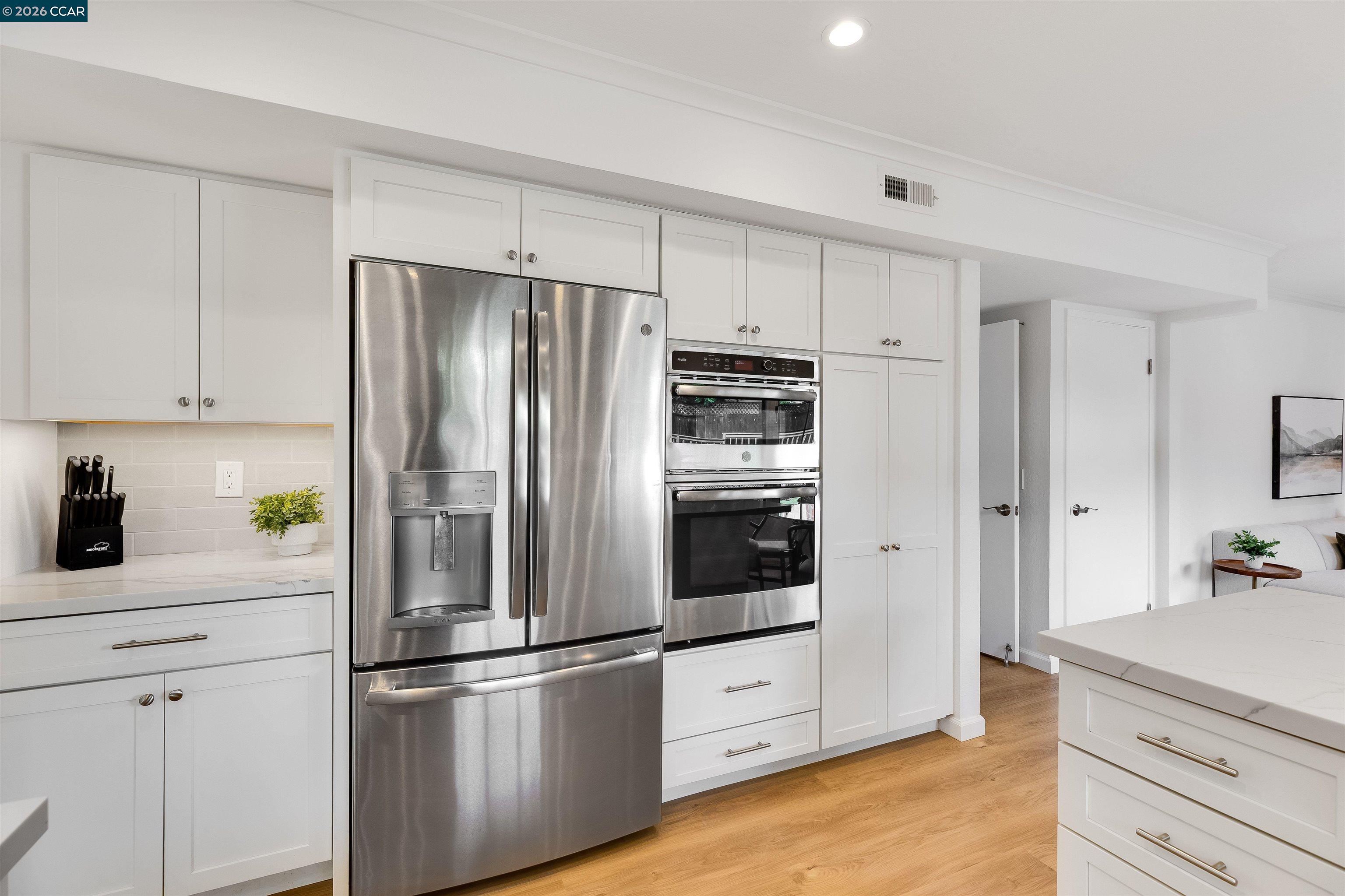 418 Devon Court San Ramon, CA 94583 - Photo 15 of 62 a kitchen with stainless steel appliances a refrigerator stove and cabinets