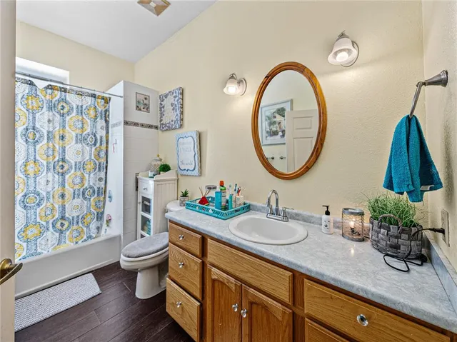 a bedroom with furniture and a flat screen tv