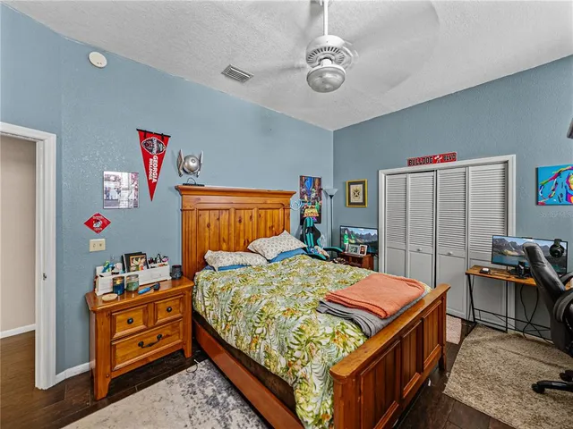 a bedroom with furniture and a window