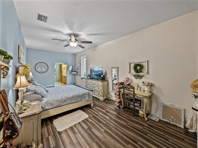 a bathroom with a sink mirror and a shower