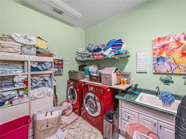 a bedroom with furniture and a flat screen tv