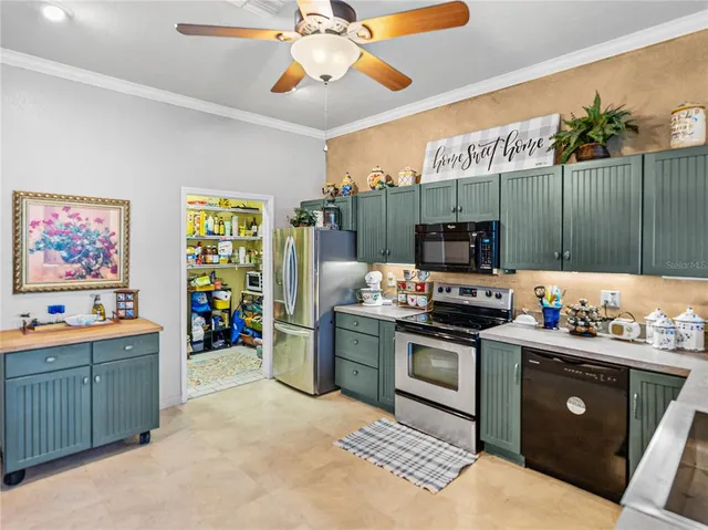 a living room with lots of furniture and a chandelier