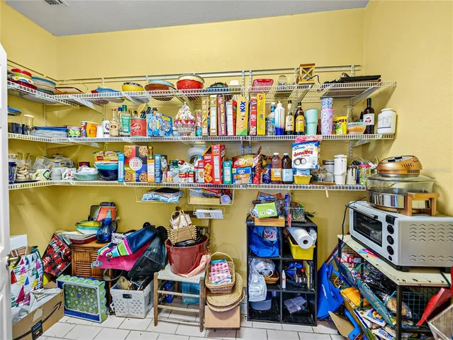 a living room with lots of furniture and a large window