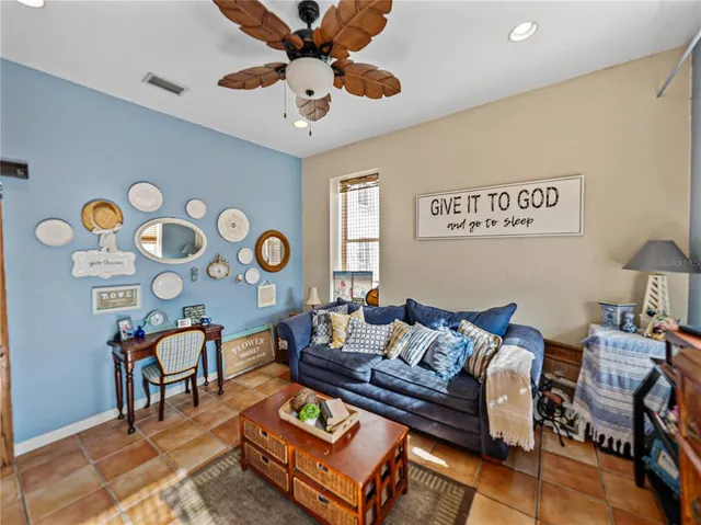 a living room with a couch and a curtain