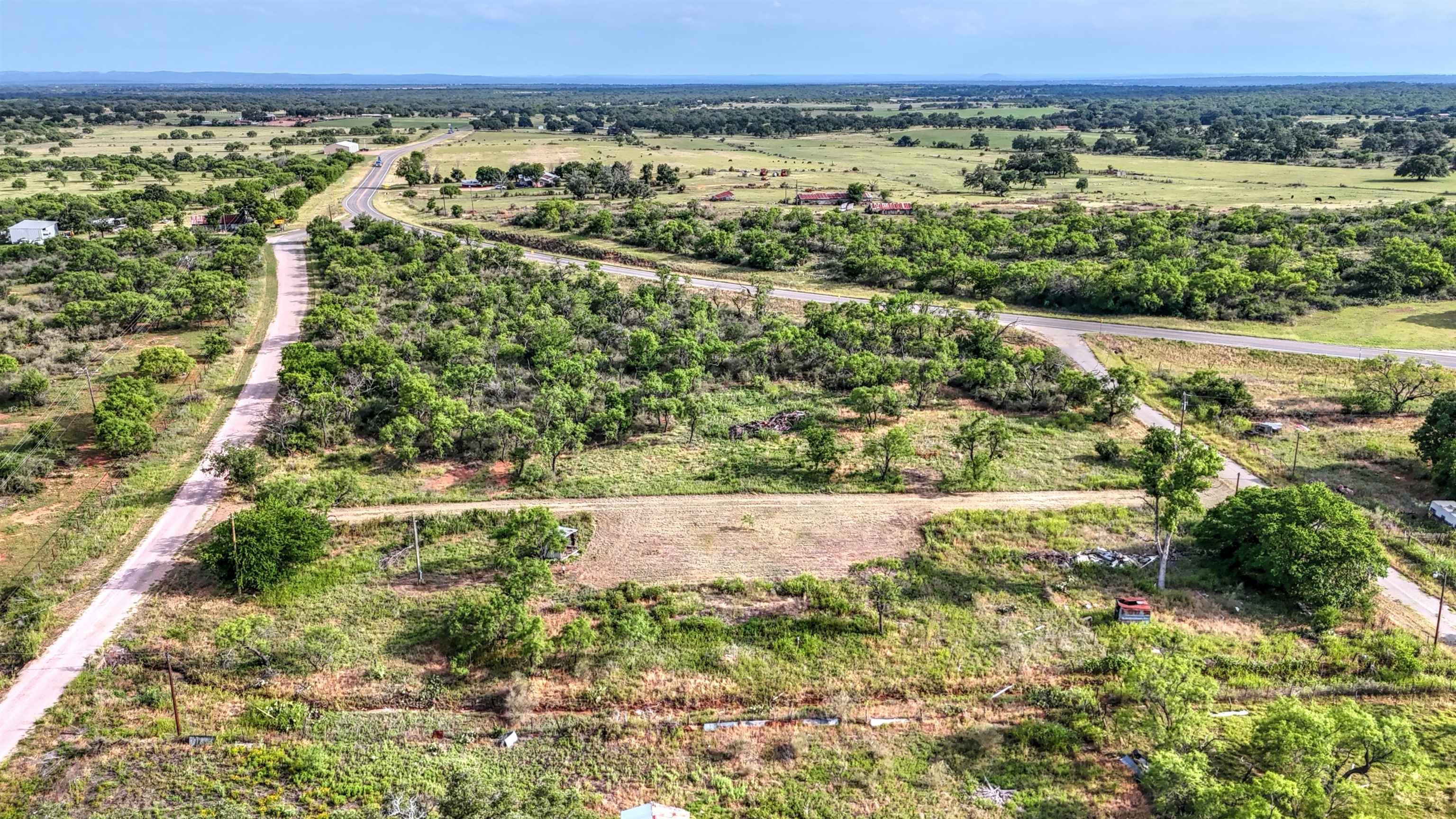 0 East Highway 71 Valley Spring, TX 76885 - Photo 25 of 25 a view of a garden with a lake