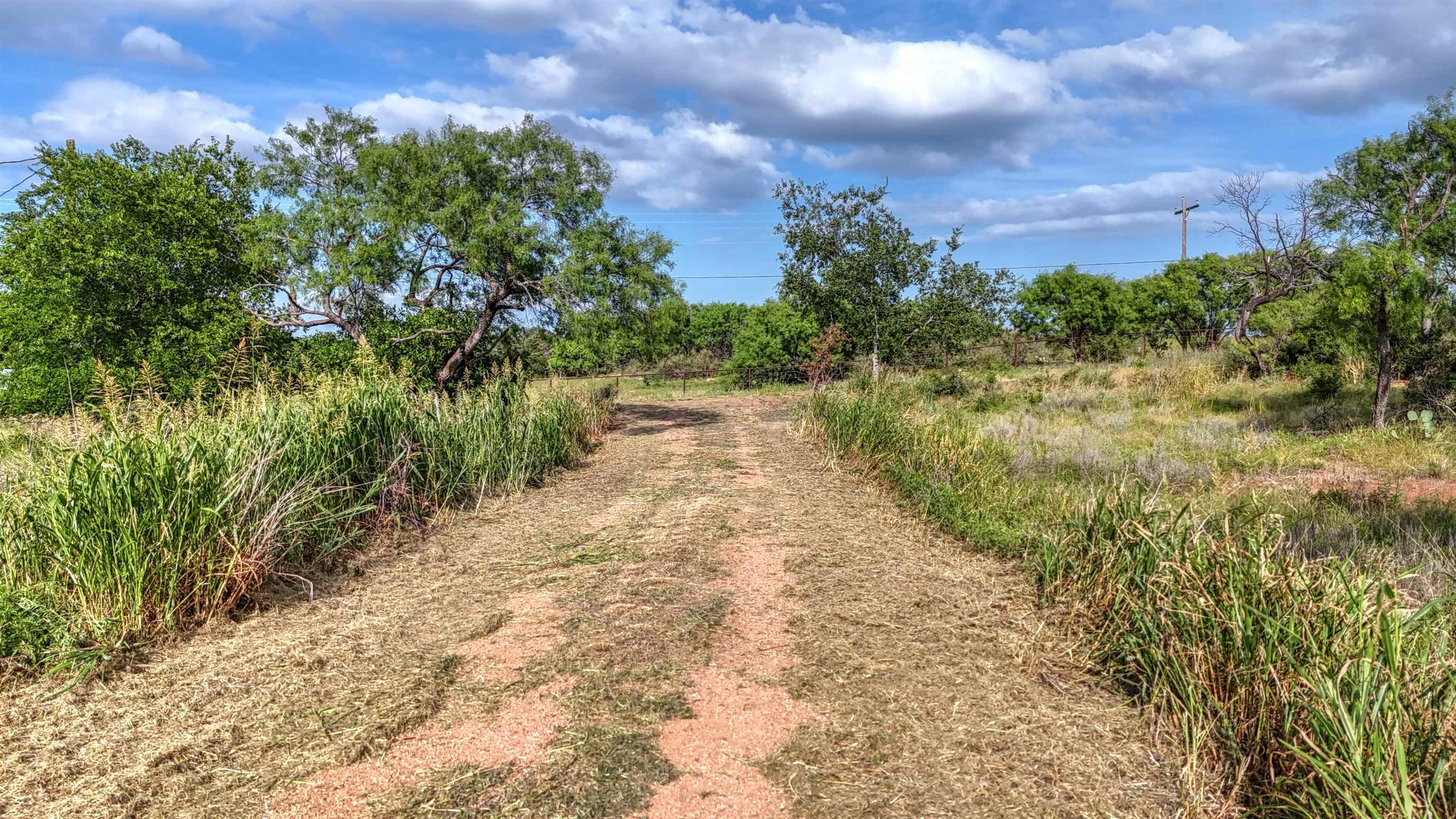 0 East Highway 71 Valley Spring, TX 76885 - Photo 5 of 25 a view of a pathway with a yard