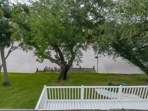 483 Riverside Drive Palacios, TX 77465 - Photo 40 of 41 a view of a deck with a garden
