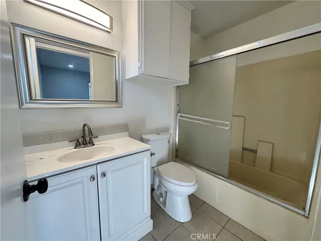a bathroom with a toilet sink and vanity