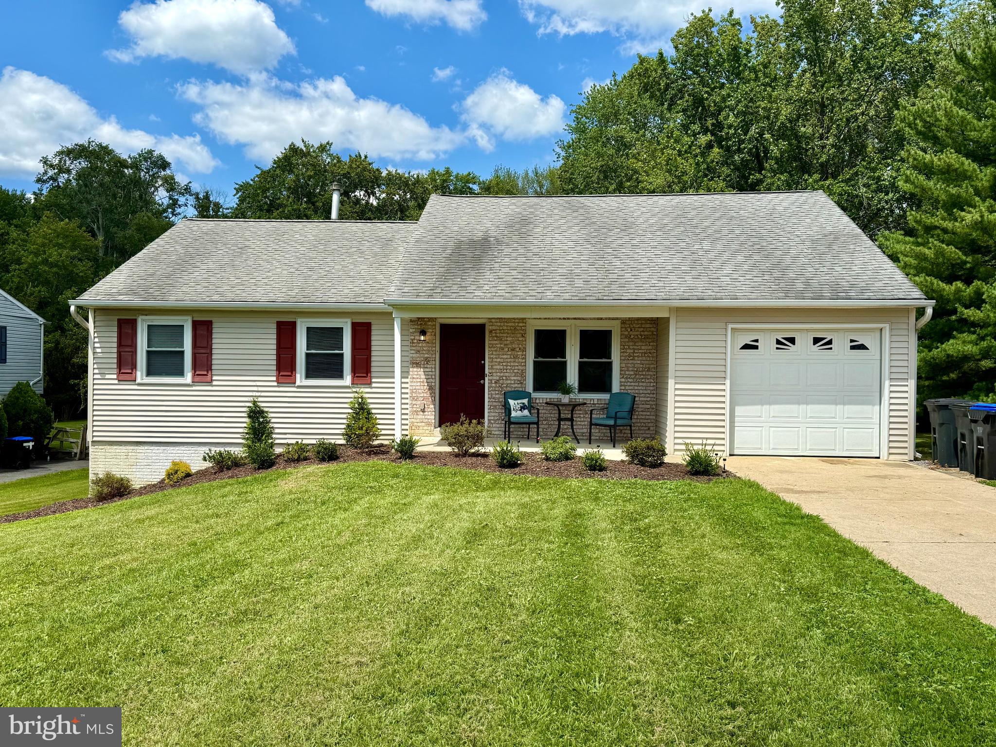 a front view of house with yard and seating area