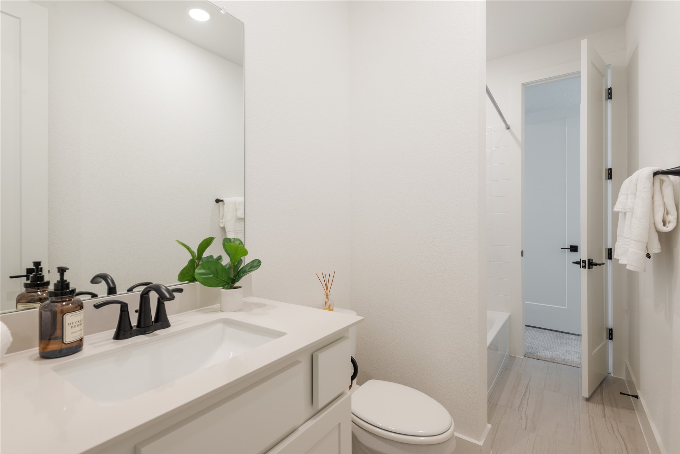 294 Kimble Creek Loop Kyle, TX 78640 - Photo 24 of 40 A well-lit, contemporary bathroom boasts elegant fixtures and clean-lined design.