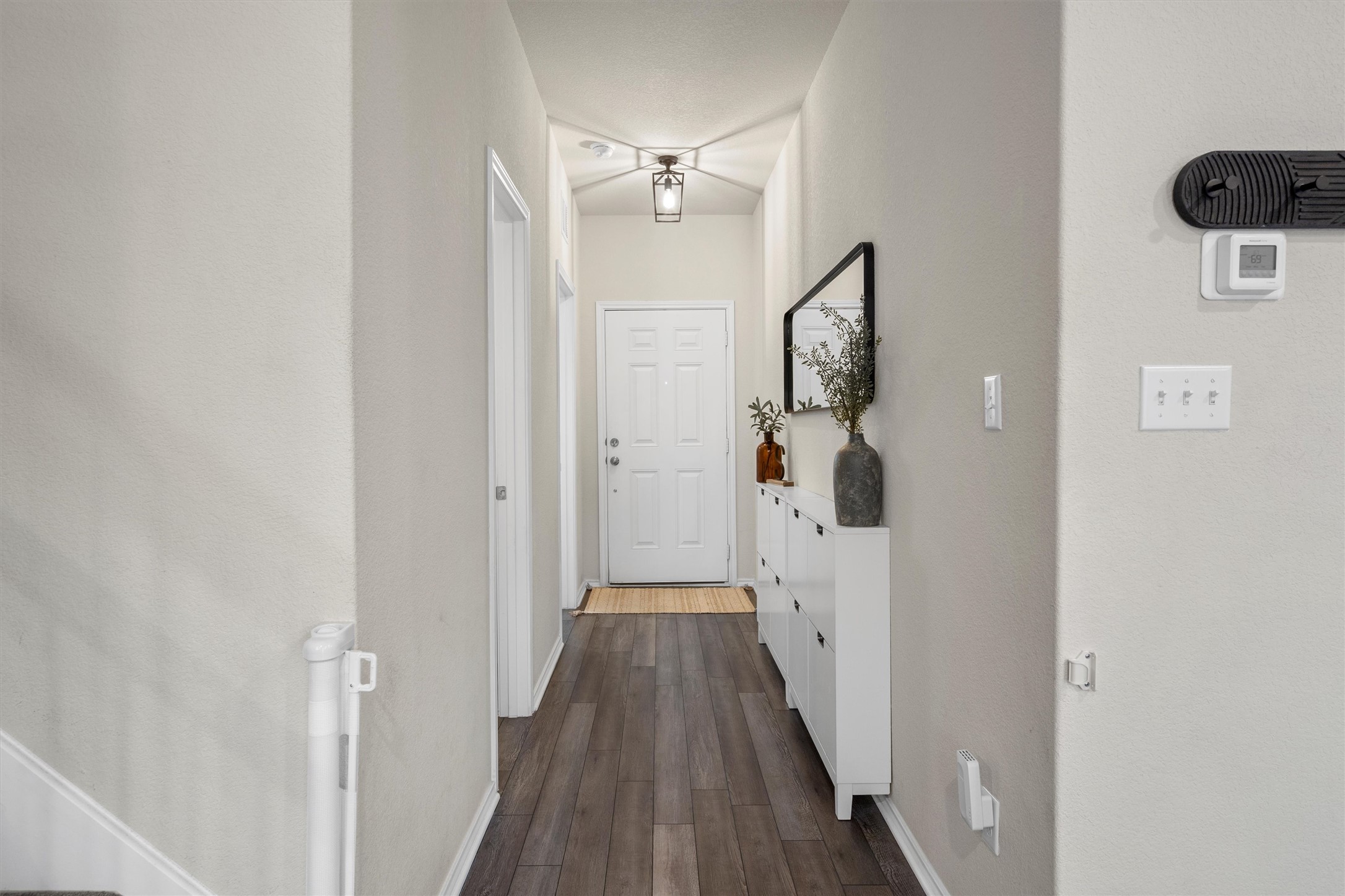 145 Fiery Skipper Lane Georgetown, TX 78626 - Photo 11 of 29 Corridor featuring baseboards and dark wood-style flooring