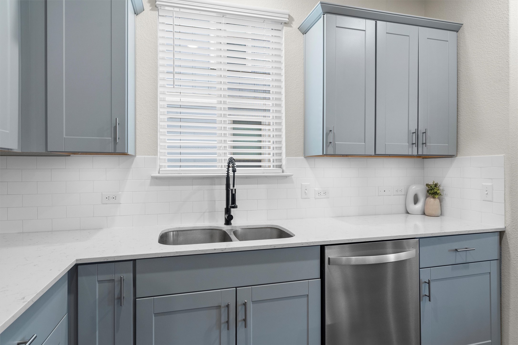 145 Fiery Skipper Lane Georgetown, TX 78626 - Photo 11 of 29 a kitchen with a sink cabinets and window