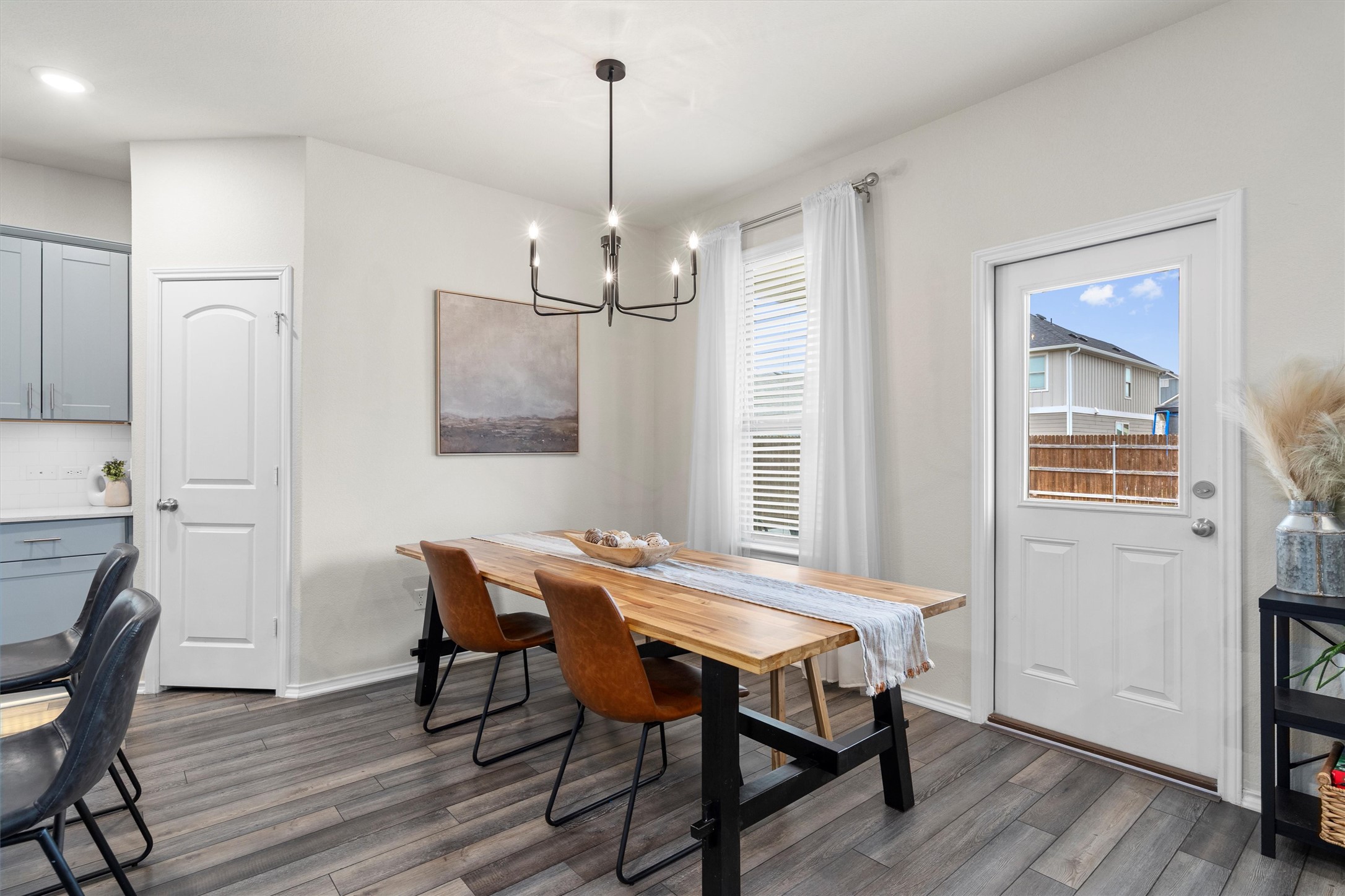 145 Fiery Skipper Lane Georgetown, TX 78626 - Photo 8 of 29 a view of a dining room with furniture window and wooden floor