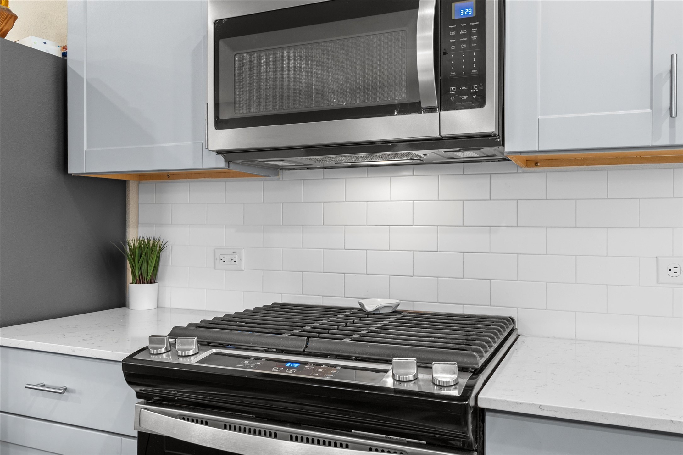 145 Fiery Skipper Lane Georgetown, TX 78626 - Photo 10 of 29 a stove top oven sitting inside of a kitchen