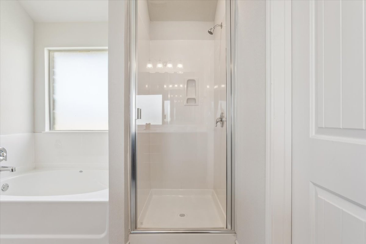 5830 Copano Road Belton, TX 76513 - Photo 23 of 34 Full bathroom with a bath and a stall shower