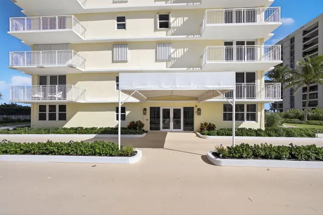 a view of living room with furniture and wooden floor