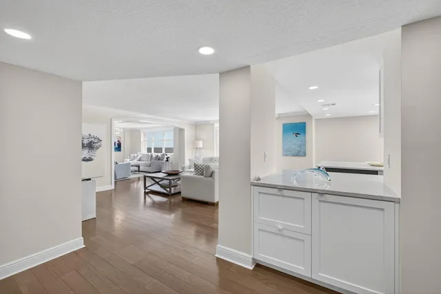 a living room with furniture and a lamp