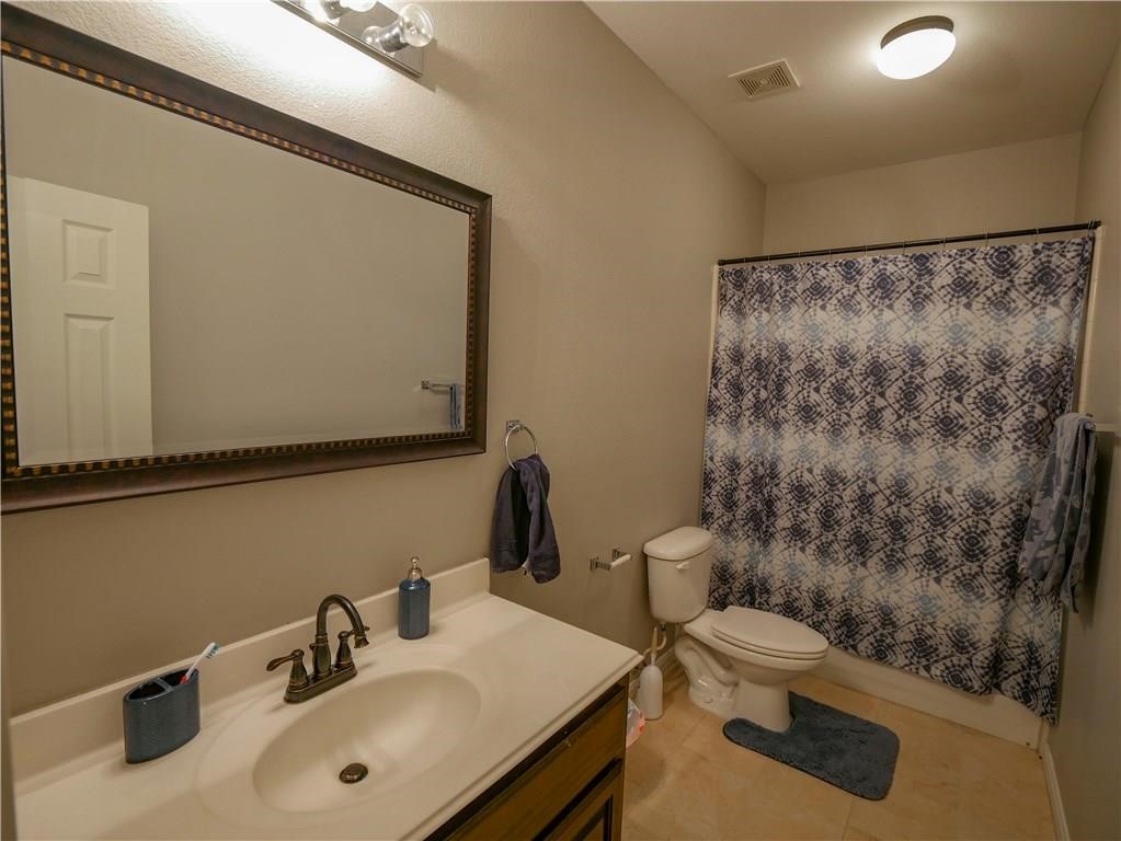 702 South Frontier Lane Cedar Park, TX 78613 - Photo 18 of 30 a bathroom with a sink toilet and shower