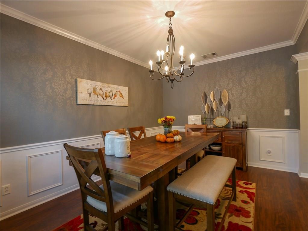 702 South Frontier Lane Cedar Park, TX 78613 - Photo 28 of 30 a view of a dining room with furniture and chandelier