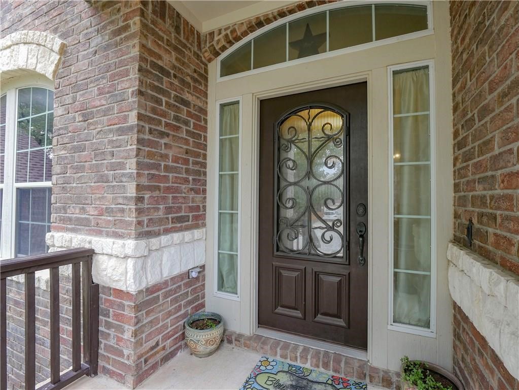 702 South Frontier Lane Cedar Park, TX 78613 - Photo 4 of 30 a front view of a building with entrance
