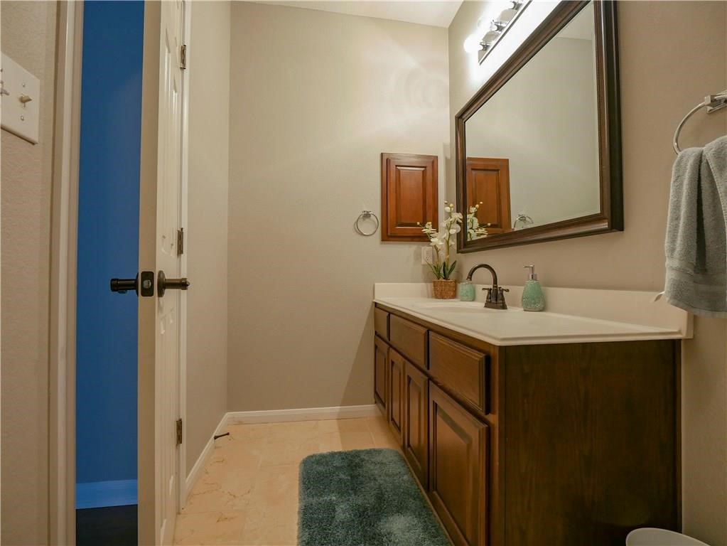 702 South Frontier Lane Cedar Park, TX 78613 - Photo 9 of 30 a bathroom with a sink and a mirror