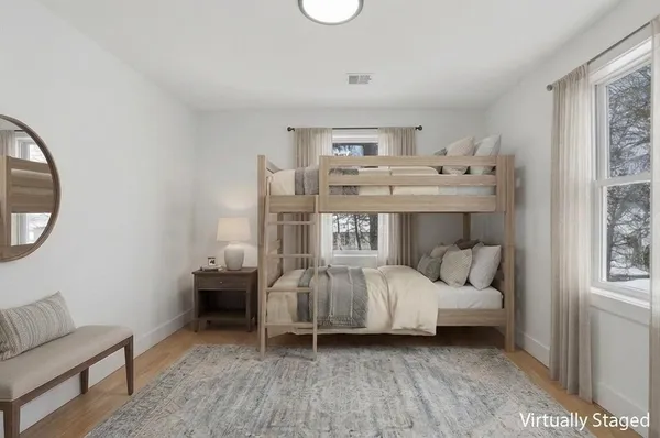 a bed room with furniture and a window
