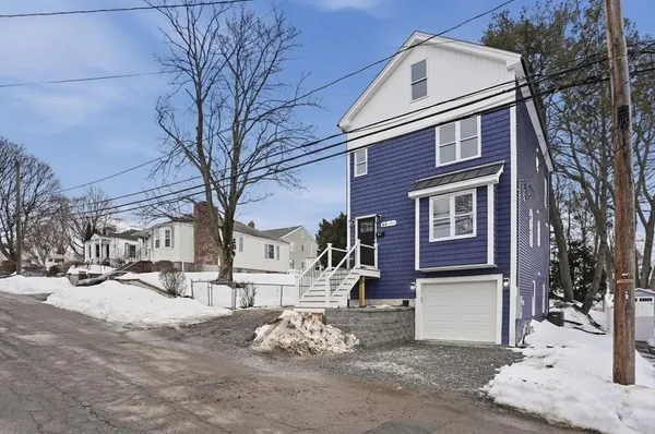 a view of a house with a snow in the yard