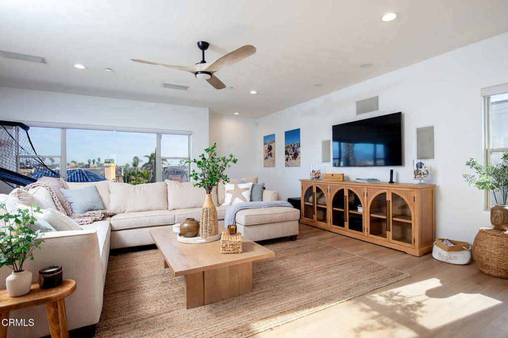 815 Mandalay Beach Road Oxnard, CA 93035 - Photo 24 of 29 a living room with furniture and a flat screen tv