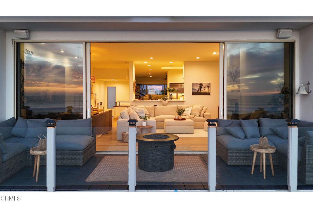 815 Mandalay Beach Road Oxnard, CA 93035 - Photo 26 of 29 a living room with fireplace furniture and a large window