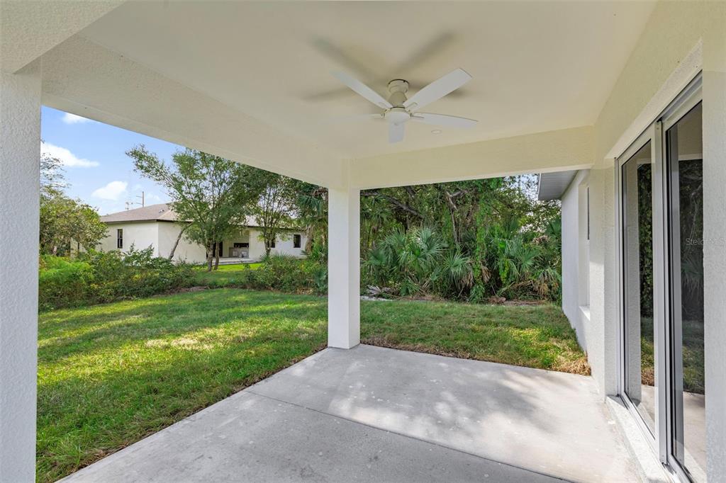 486 Celeste Street Port Charlotte, FL 33954 - Photo 13 of 35 a view of a porch with a yard