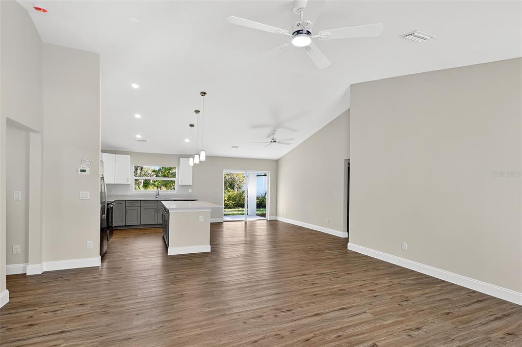 486 Celeste Street Port Charlotte, FL 33954 - Photo 14 of 35 a view of kitchen with furniture and wooden floor