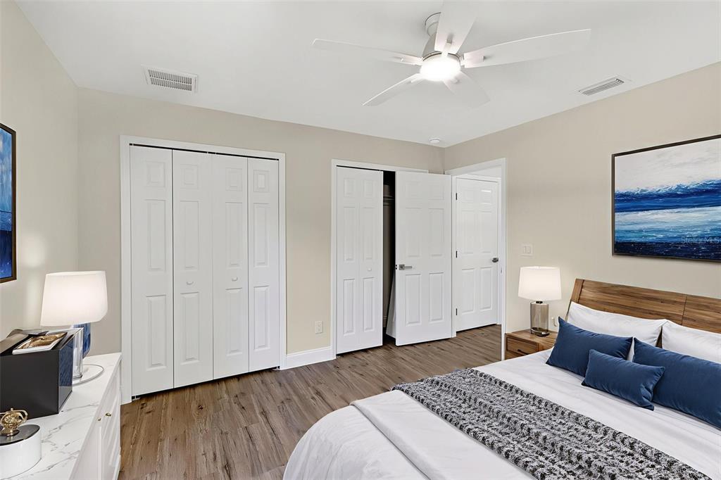 486 Celeste Street Port Charlotte, FL 33954 - Photo 26 of 35 a bedroom with a bed and a lamp on dresser