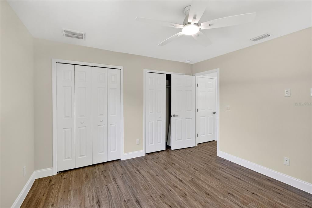 486 Celeste Street Port Charlotte, FL 33954 - Photo 27 of 35 a view of an empty room with wooden floor