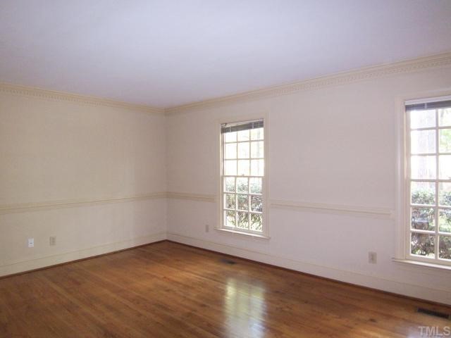 2216 Effingham Circle Raleigh, NC 27615 - Photo 2 of 12 The gracious hardwd-floored Foyer leads to the formal Living Rm w/hrdwd flr, chair rail & dentil crown molding.