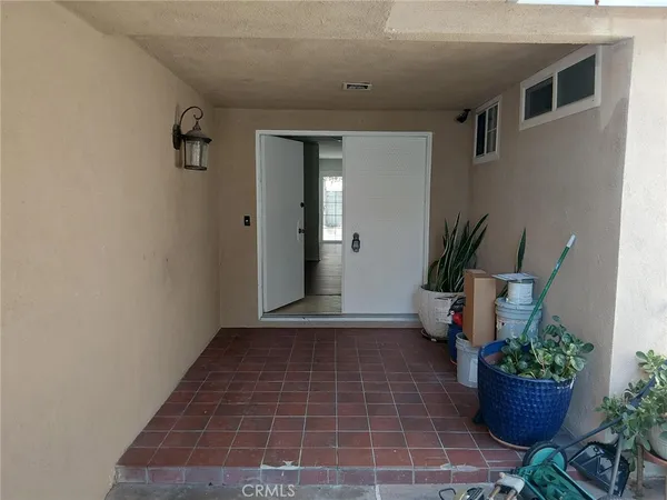 a view of an entryway with wooden floor
