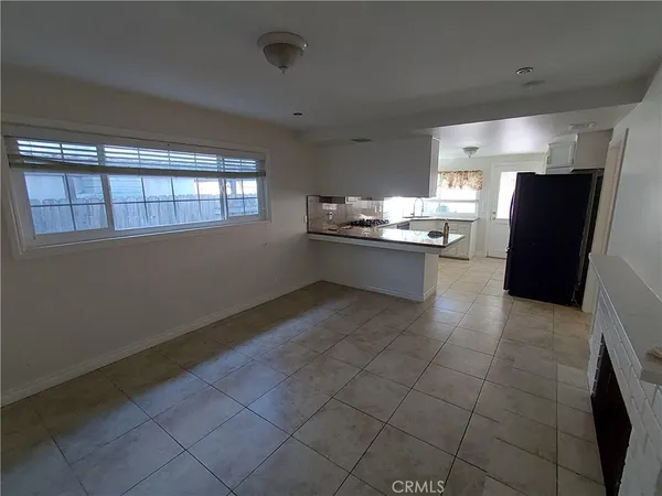 a kitchen with stainless steel appliances a stove a refrigerator and a sink