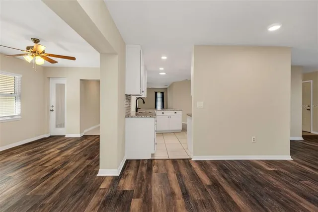 a kitchen with stainless steel appliances kitchen island granite countertop a stove a sink and a microwave