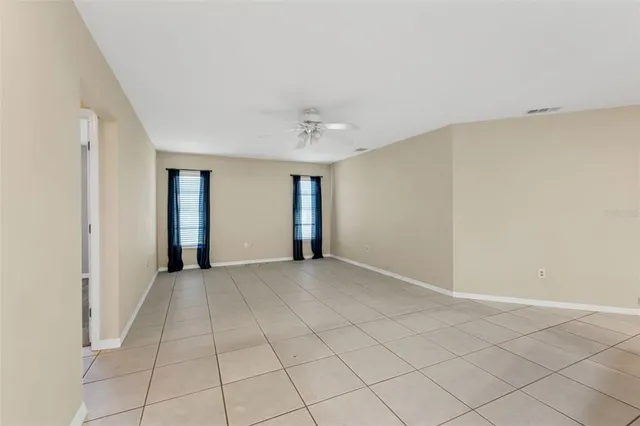 a view of outdoor space with wooden floor and windows