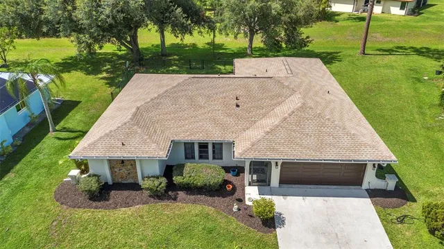 an aerial view of residential house with outdoor space