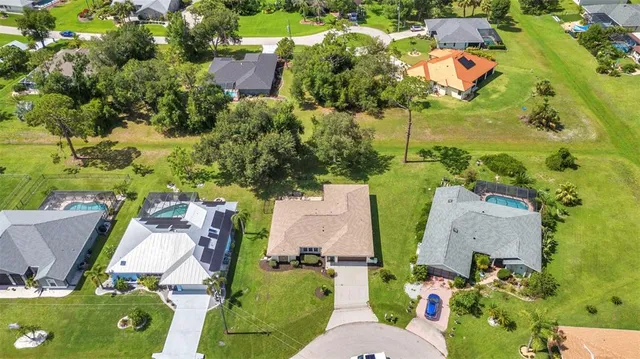 an aerial view of residential houses with outdoor space