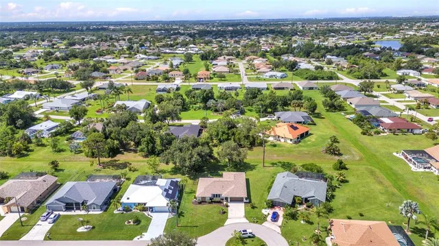 an aerial view of residential house with outdoor space and swimming pool