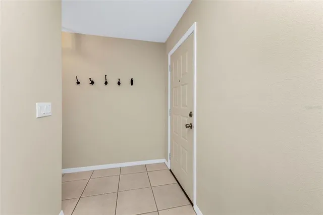 a view of an empty room and wooden floor