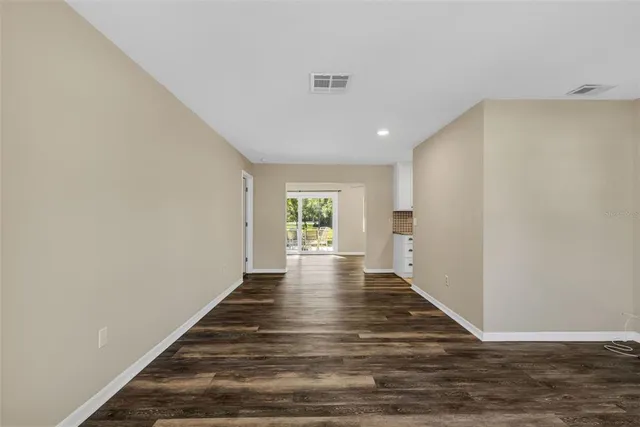 a view of a living room and wooden floor