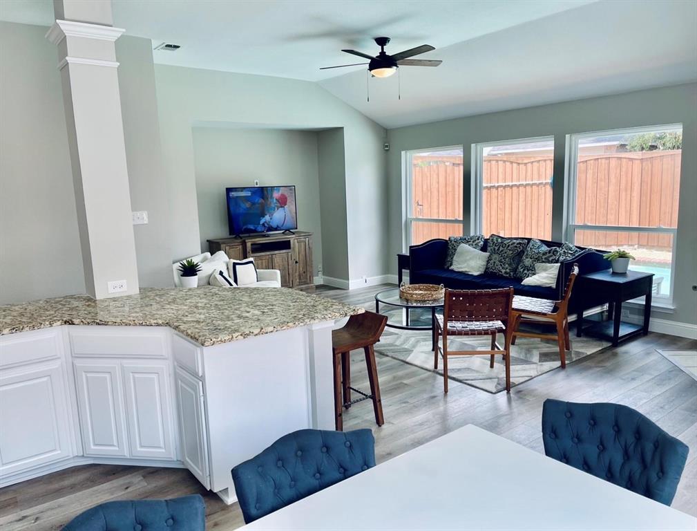 7848 Lancelot Road Frisco, TX 75035 - Photo 13 of 27 a living room with furniture and a flat screen tv